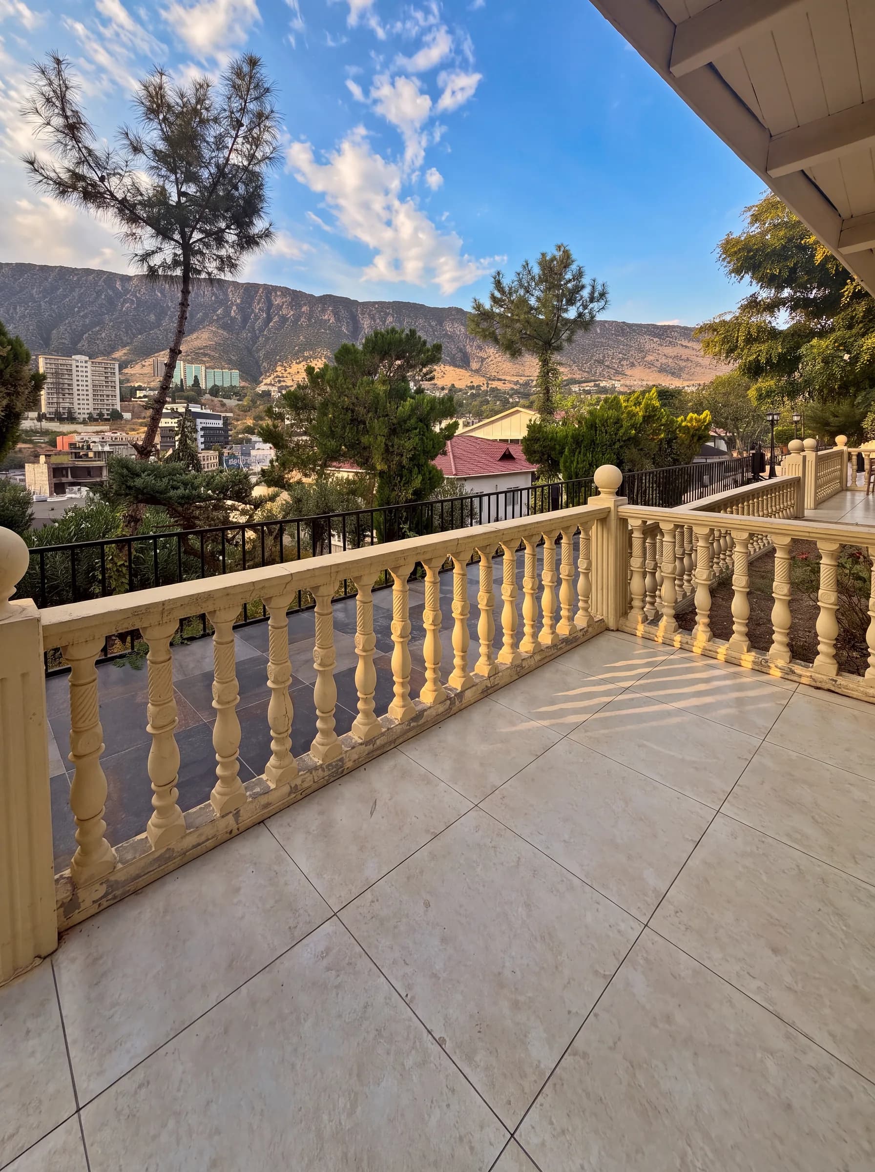 A cabin terrace facing Safeen Mountain