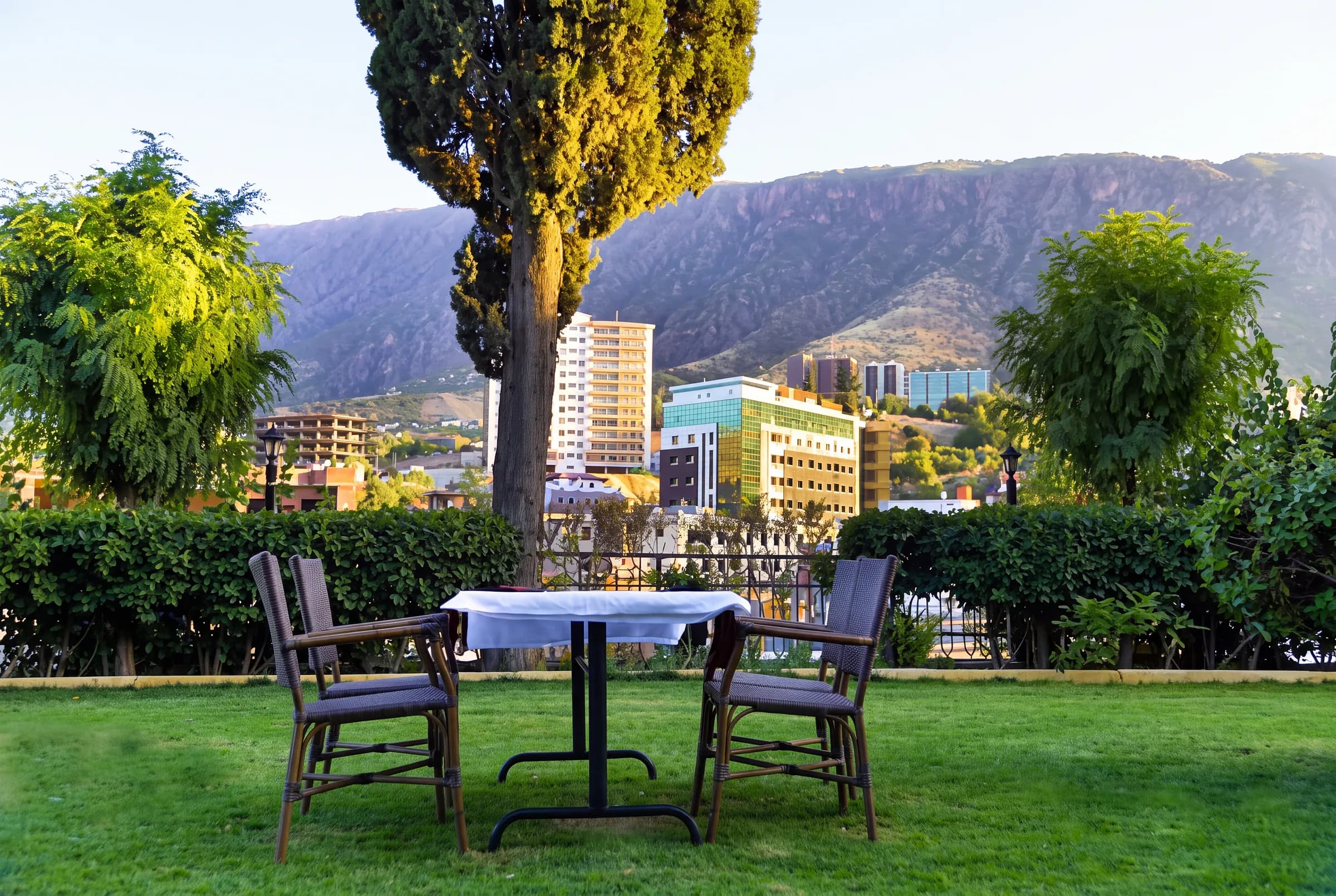 A garden table and chairs overlooking Shaqlawa and Safeen Mountain.